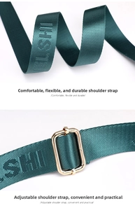 Detail of adjustable dark green nylon strap with textured letters and gold metal buckle