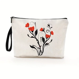 Elegant cream makeup bag with floral print featuring black zipper and wristlet strap