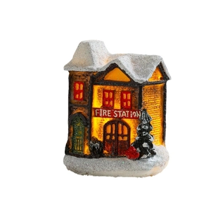 Lighted Christmas Fire Station miniature with snow detail and warm glow for holiday decor