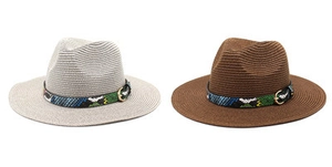 Detail of wide brim straw hats with bohemian patterned bands and gold metal buckles