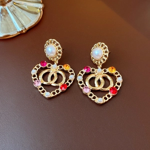 Elegant gold heart earrings with white pearls and colorful rhinestones in retro style