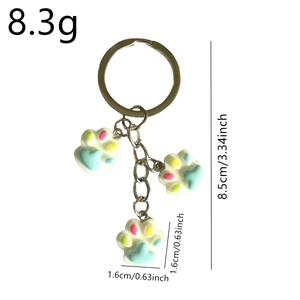 Cute resin cat paw keychain with three colorful pendants and metal ring for bags