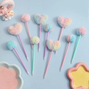 Detail of plush heart pom pom ball pens in pastel gradient colors for student stationery