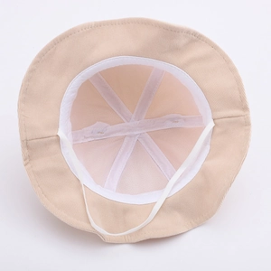 Breathable mesh lining and elastic chin strap detail of the beige baby sun bucket hat