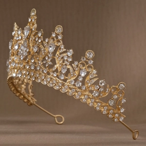 Detailed close-up of a luxury gold bridal crown with sparkling crystal rhinestones