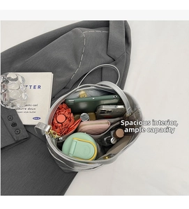 Detailed interior view of a silver tote bag showing large capacity and zipper pocket