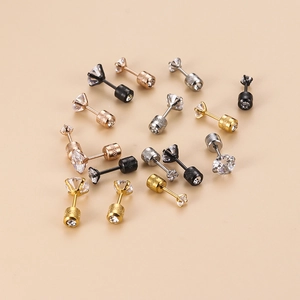 Macro shot of stainless steel stud earrings in gold silver black and rose gold with zircon