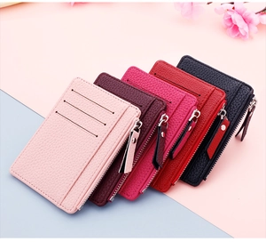 Detail of slim lychee leather card holders with zipper pocket in multiple colors