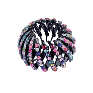 Close-up of bird nest hair clip with colorful rhinestones and black flocked finish