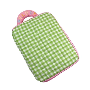 Quilted checkered laptop sleeve with green and white grid and pink Melody embroidery