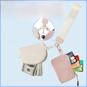 Waterproof nylon wristlet set with cream coin pouch and pink card holder for storage