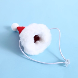 Close-up of mini plush Christmas pet hat with red felt and adjustable toggle strap