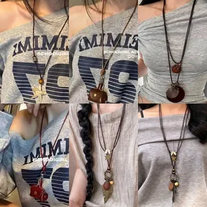 Retro Ethnic Long Pendant Necklace With Wood Beads Alloy Star Feather And Leather Cord Bohemian Style Jewelry For Women