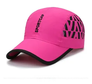 Close-up of rose red sports cap with SPORTCAP lettering and breathable mesh side panels