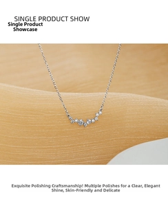 Macro detail of S925 silver smile necklace featuring micro-set zircon on a wave pendant