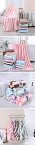 Detail view of striped coral fleece towel set in multiple colors with high absorption texture