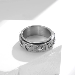 Rotating stainless steel spinner ring with celestial sun moon and stars engraving