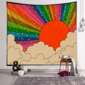 Detail of bohemian rainbow sun tapestry on white brick wall for room decor