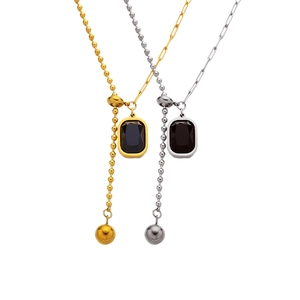 Gold and silver Y-shaped toggle necklaces with black rectangular pendants and sliding beads