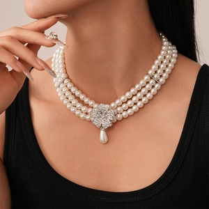Detail of multi-layer pearl choker with crystal floral pendant and teardrop pearl