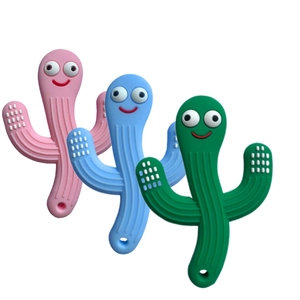 Detailed view of three colorful silicone baby pacifiers with funny smiles and textures