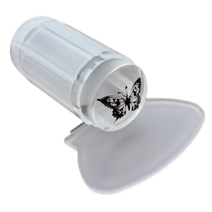 Clear silicone nail stamper with purple handle and scraper featuring a butterfly pattern