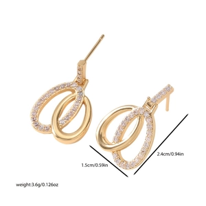 Gold double-loop earrings with zircons measuring 2.4cm by 1.5cm on white background