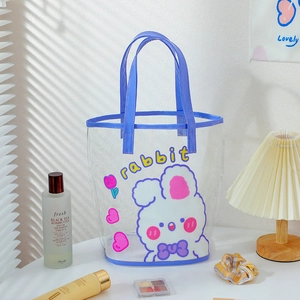 Detail of transparent PVC tote with purple leather handles and cute rabbit print graphics