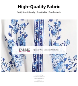 Detail of blue floral porcelain style print on soft breathable white fabric dress