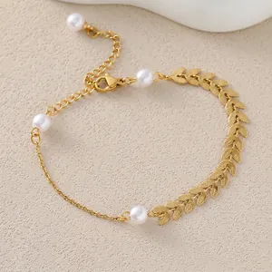 Elegant gold leaf and pearl bracelet with adjustable chain on minimalist beige texture