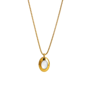 French vintage gold necklace with oval white shell pendant on a clean white background