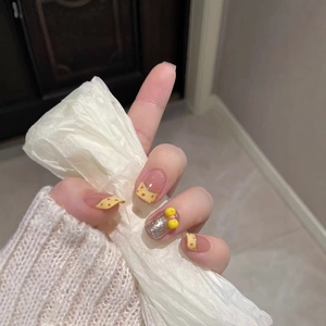Sweet cheese-themed press-on nails in yellow and transparent with 3D bow and glitter