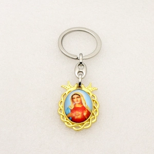 Detailed macro view of religious Sacred Heart of Mary pendant with gold wavy frame