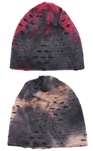 Close-up of tie-dye knitted beanies featuring distressed hole design and street style texture