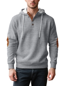 Detail view of gray men's hoodie with geometric twill texture and brown button collar