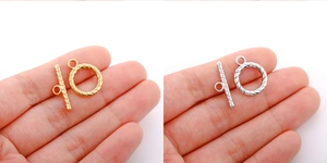 Detail of 18k gold and silver stainless steel OT toggle clasps with spiral texture