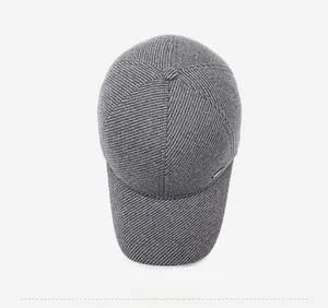 Top view of a grey knitted baseball cap showing the fine twill texture and top button