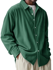 Close-up of dark green corduroy shirt showing detailed ribbed texture and classic buttons