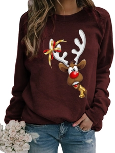 Detail of Christmas reindeer print on a wine red long-sleeved crewneck sweatshirt