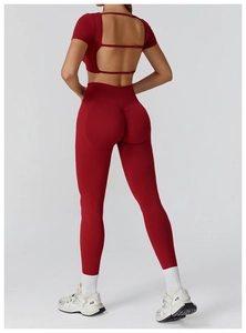 Rear view of dark red seamless yoga set featuring cutout back and butt lifting effect