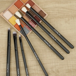 Macro view of 7-piece professional eye makeup brush set with soft gradient bristles