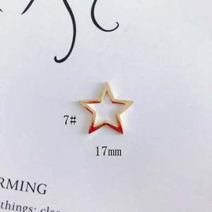 Detailed view of a 17mm gold hollow star alloy charm for DIY jewelry making