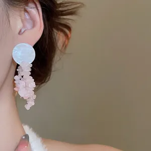 Elegant silver needle earrings with white pearl disc and pink natural stone tassels
