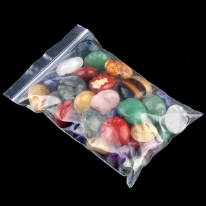 Bag of polished natural crystal agate stones in vibrant mixed colors for home decor