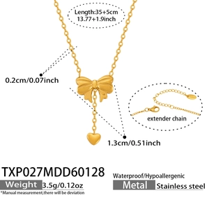 Detail view of gold bow heart necklace dimensions with 35cm chain and 5cm extender