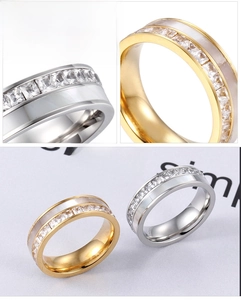 Macro detail of wide eternity ring with channel-set square stones and shell inlay