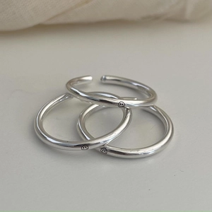 Three-piece set of polished 925 sterling silver smiley face rings in minimalist style