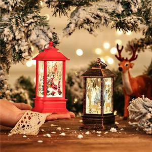 LED Christmas lantern featuring Santa Claus and reindeer on a rustic wooden table