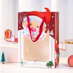 Weihnachts-Geschenktüte mit Fenster und festlichen Motiven, rote Bandgriffe