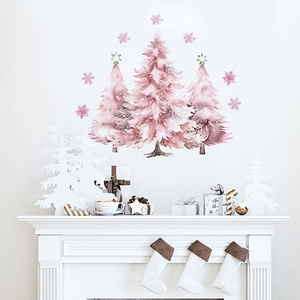 Pink watercolor Christmas tree wall decals decorated above a white festive fireplace